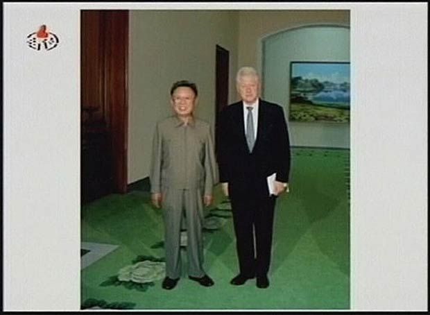 A TV still of former president Bill Clinton meeting North Korean leader Kim Jong-Il